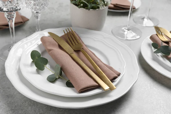 Stylish Setting Cutlery Eucalyptus Leaves Light Grey Table Closeup — Stock Photo, Image