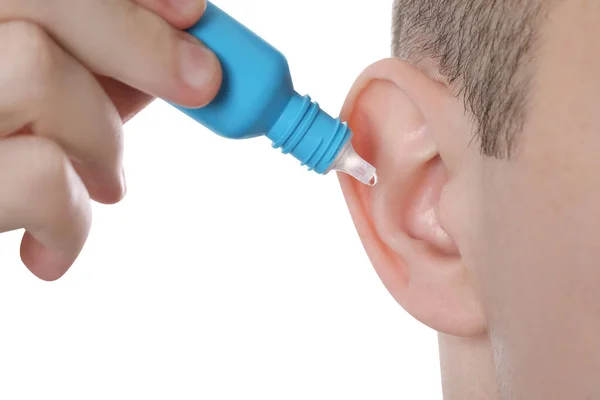 Man Using Ear Drops White Background Closeup — Stock Photo, Image