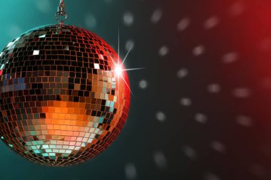 Shiny bright disco ball under color lights, space for text clipart