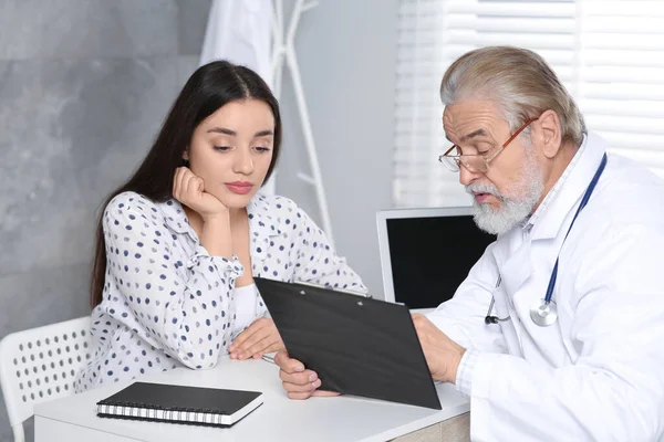 Senior Doctor Consulting Patient White Table Clinic — Stock Photo, Image