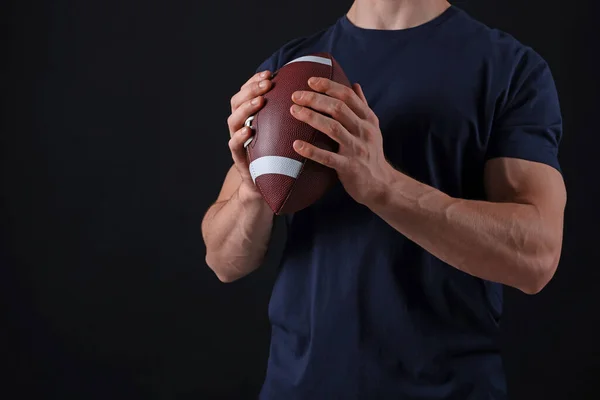 Athletic Man American Football Ball Black Background Closeup Space Text — 图库照片