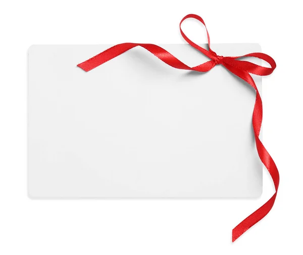 白い上面に赤い弓で隔離された空のギフトカード — ストック写真