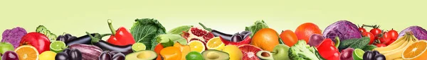 Many different fresh fruits and vegetables on pale light green background. Banner design