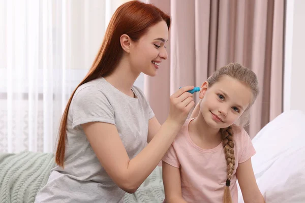Mother Dripping Medication Daughter Ear Bedroom — Stock Photo, Image