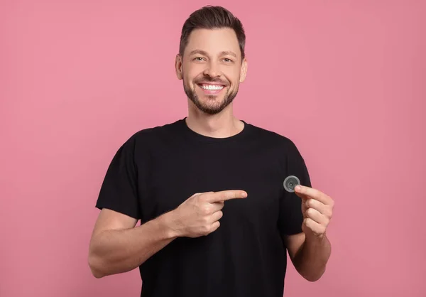 Happy Man Holding Condom Pink Background — Stock Photo, Image