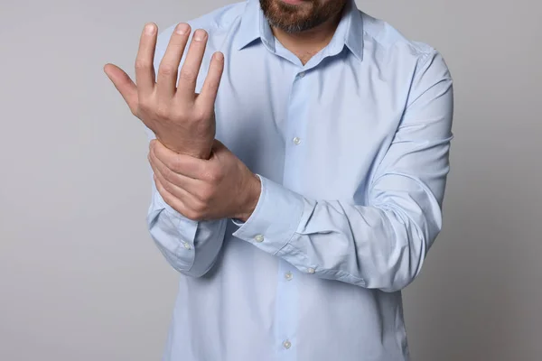 Man Suffering Pain His Hand Light Background Closeup Arthritis Symptoms — Stock Photo, Image