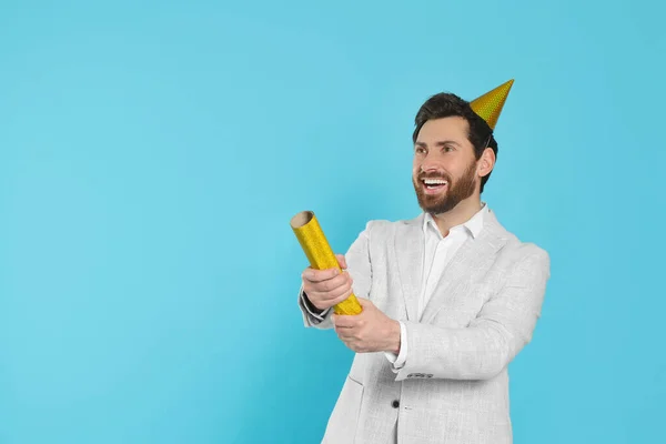Happy Man Party Popper Light Blue Background Space Text — Stock Photo, Image