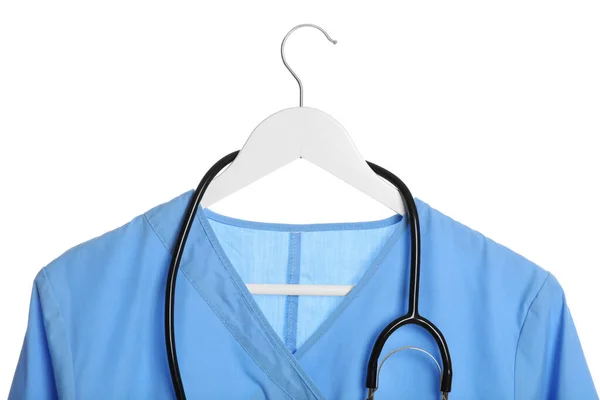 白色背景的浅蓝色医疗制服和听诊器 — 图库照片