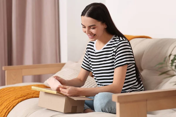 Happy Young Woman Opening Parcel Sofa Home Internet Shopping — Stock Photo, Image