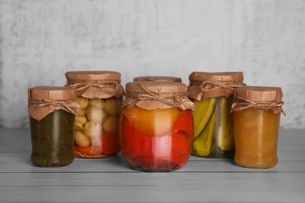 Many Glass Jars Different Preserved Products Wooden Table Stock Image