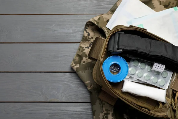 Military First Aid Kit Uniform Wooden Table Flat Lay Space — Stock Photo, Image