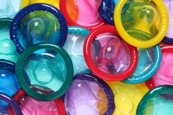 Colorful Unpacked Condoms Background Closeup Safe Sex — Stock Photo, Image