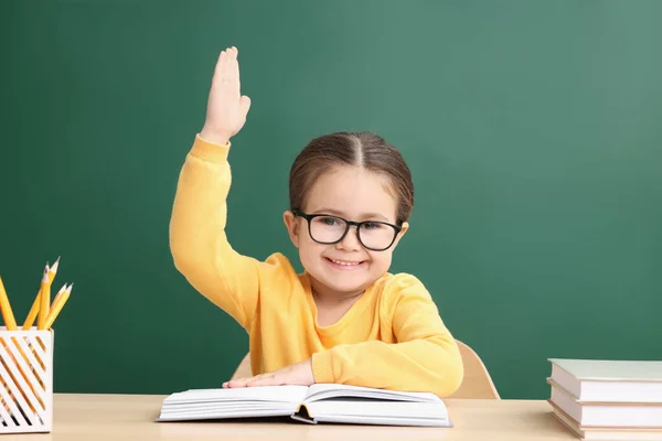 Happy Little School Child Raising Hand While Sitting Desk Books — Stock Photo, Image