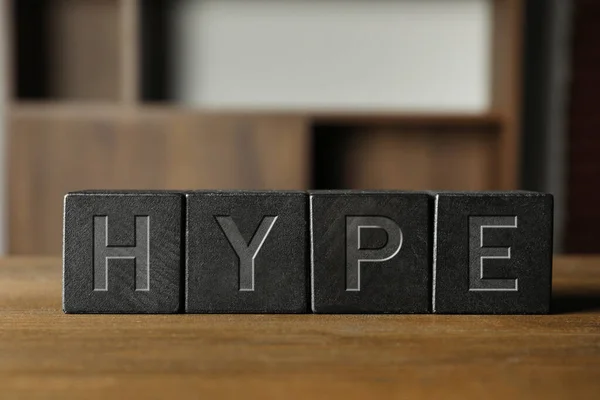 stock image Word Hype of black cubes with letters on wooden table