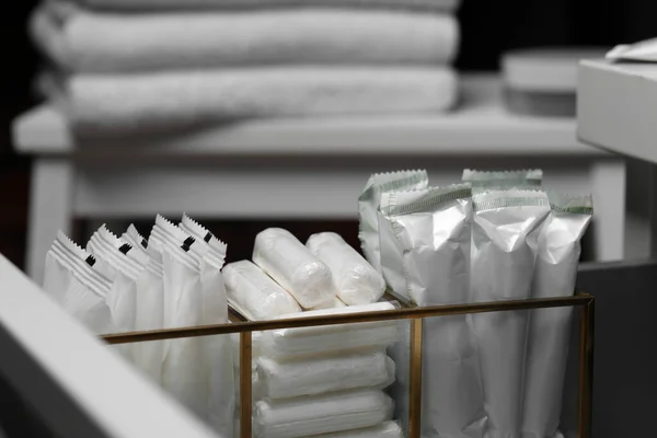 Organizer with different feminine hygiene products, closeup