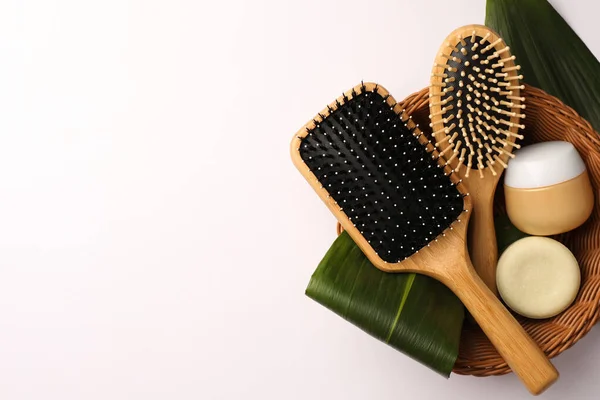 Wicker Basket Wooden Hairbrushes Cosmetic Products Green Leaves White Background — Stock Photo, Image