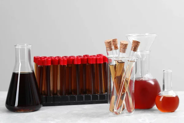 Different Laboratory Glassware Brown Liquids White Table — Fotografia de Stock