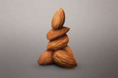 Gri gradyan arkaplanda bir sürü badem fıstığı