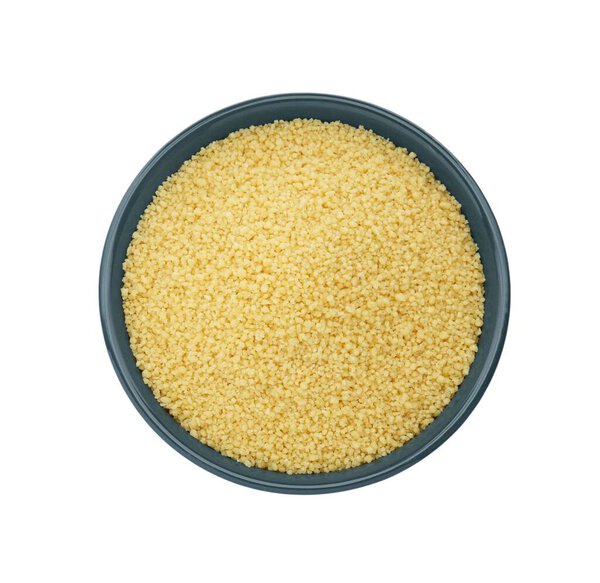Bowl of raw couscous isolated on white, top view