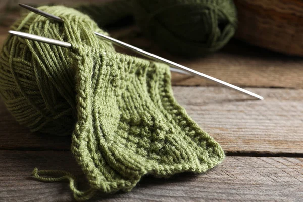 Soft Green Woolen Yarn Knitting Needles Wooden Table Closeup — Stock Photo, Image