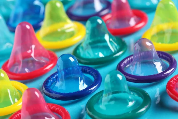 Colorful Condoms Light Blue Background Closeup — Stock Photo, Image
