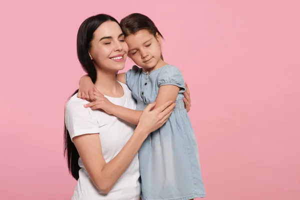 stock image Happy woman with her cute daughter on pink background, space for text. Mother's day celebration