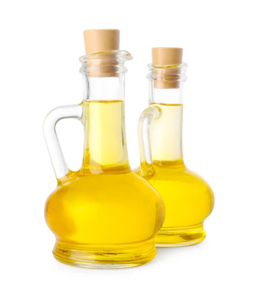 Stock image Glass jugs of cooking oil on white background