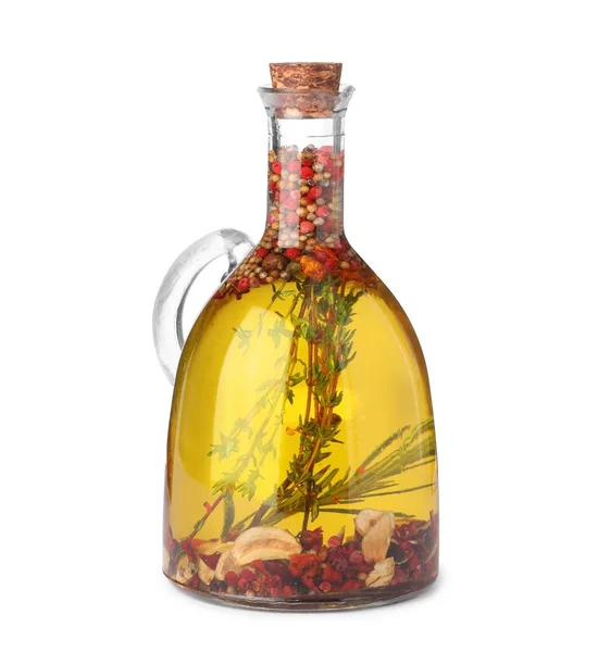 stock image Glass jug of cooking oil with spices and herbs isolated on white