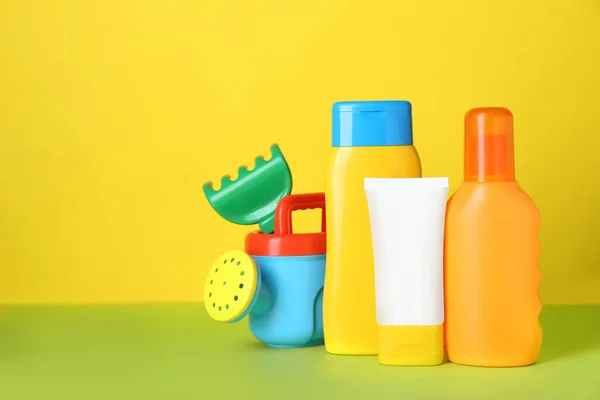 Different Suntan Products Plastic Beach Toys Color Background Space Text — Stock Photo, Image