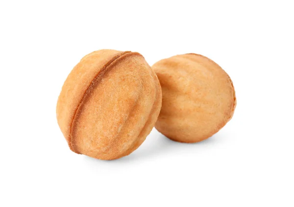 Delicious nut shaped cookies with condensed milk on white background