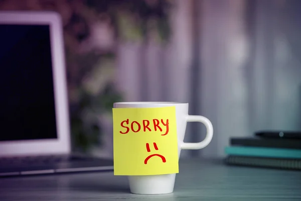Apology Sticky Note Word Sorry Drawn Sad Face Attached Cup — Stock Photo, Image