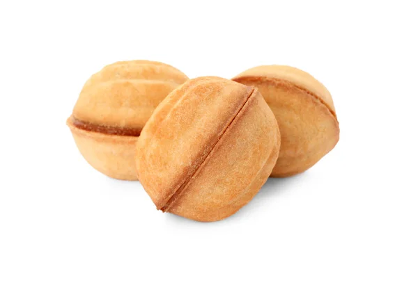 Delicious nut shaped cookies with condensed milk on white background