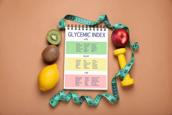 Glykemiskt Index Information Gruppering Produkter Anteckningsbok Måttband Hantlar Och Frukter — Stockfoto