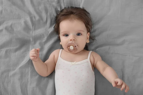 Cute Little Baby Pacifier Bed Top View — Stock Photo, Image