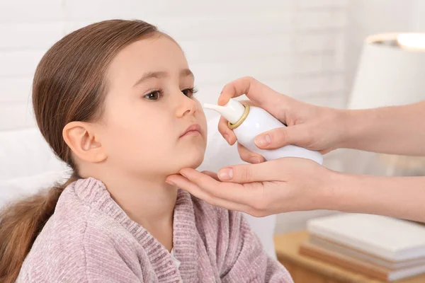 Mother Using Nasal Spray Treat Her Little Daughter Indoors Closeup — Stock Photo, Image