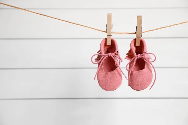 Pink Baby Shoes Drying Washing Line White Wall Space Text — Stock Photo, Image