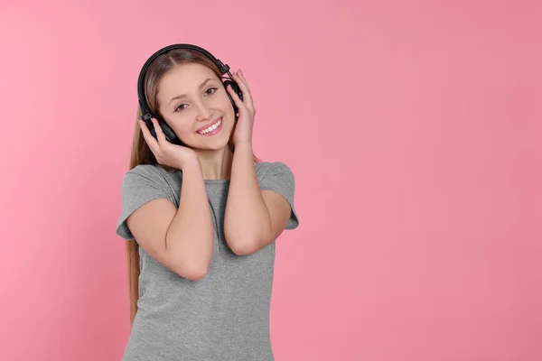 Teenage Girl Listening Music Headphones Pink Background Space Text — 스톡 사진