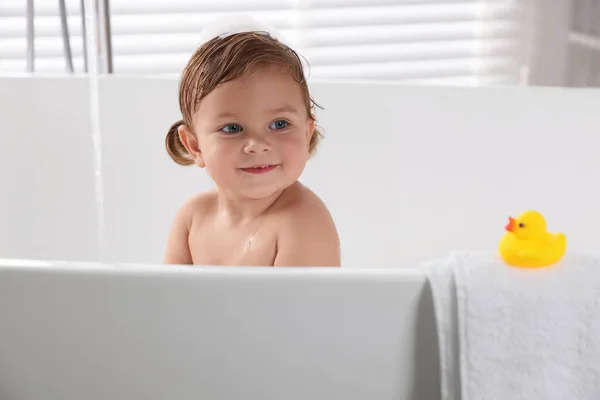 Cute Little Girl Taking Bath Toy Indoors — Stock Photo, Image