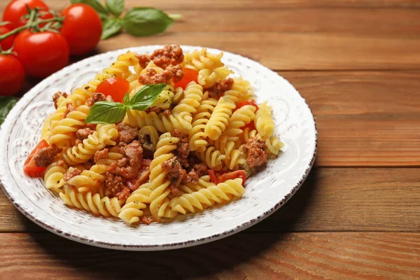 Plate Delicious Pasta Minced Meat Tomatoes Basil Wooden Table Closeup — Stock Photo, Image
