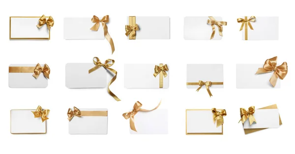 Набір Різних Подарункових Карток Золотими Бантами Білому Тлі Вид Зверху — стокове фото