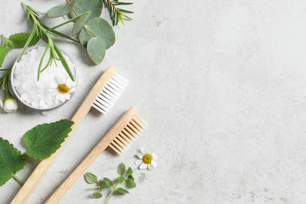 Bamboo Toothbrushes Flowers Herbs Light Grey Table Flat Lay Space — Stock Photo, Image
