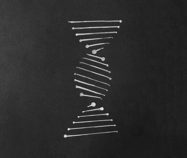 Drawing of DNA molecular chain on black paper, top view