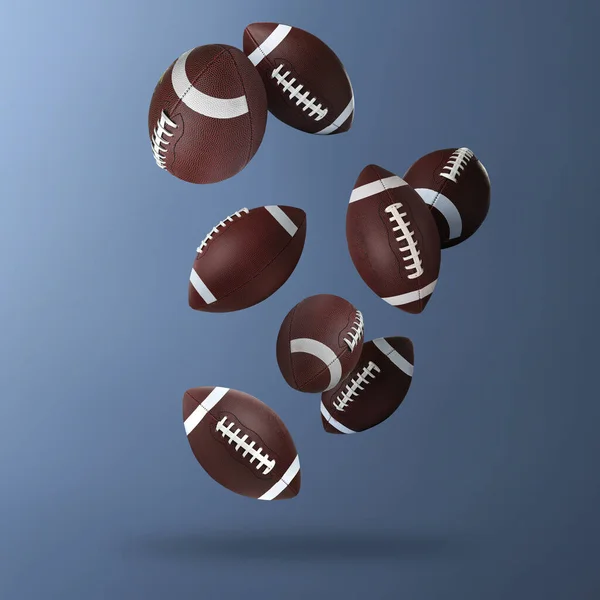 Кожаные Американские Футбольные Мячи Падают Стальной Синий Градиентный Фон — стоковое фото