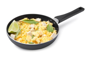 Frying pan with delicious scrambled eggs, tofu and lime isolated on white