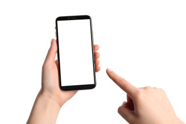 Woman holding smartphone with blank screen on white background, closeup. Mockup for design