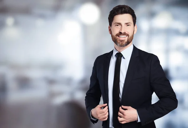 Handsome real estate agent in office, space for text