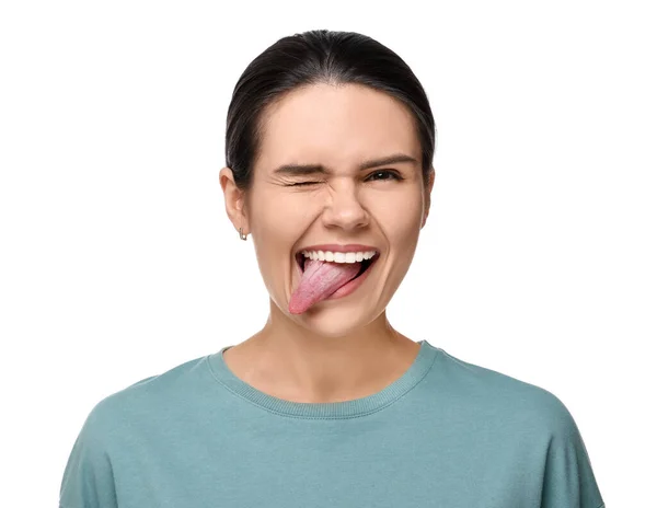 Щаслива Молода Жінка Показує Язик Білому Тлі — стокове фото