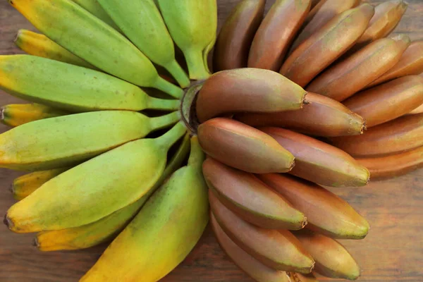 Diferentes Tipos Bananas Mesa Madeira Vista Superior — Fotografia de Stock