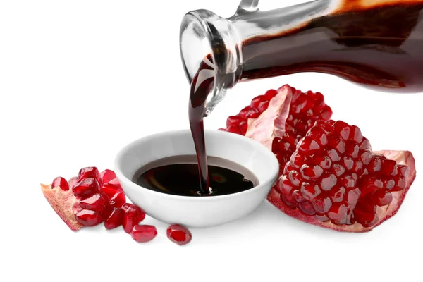 Pouring Pomegranate Sauce Bowl Fresh Ripe Fruit White Background — Stock Photo, Image