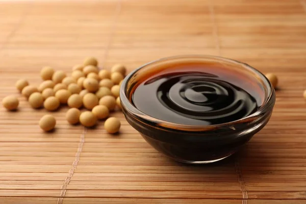 Soy Sauce Bowl Soybeans Bamboo Mat Closeup Royalty Free Stock Images